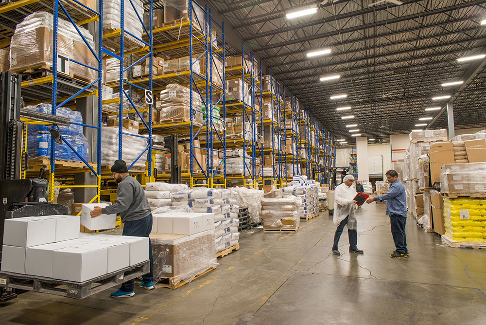 Large Vitaquest Warehouse active business work day with ingredients and orders for custom formulated manufacturing of vitamin supplements and nutraceuticals Large Vitaquest Warehouse active business work day with ingredients and orders for custom formulated manufacturing of vitamin supplements and nutraceuticals